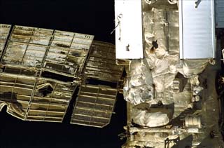 Mir space station taken by the crew of the STS-86 orbiter Atlantis including Spektr and its damaged solar array. 